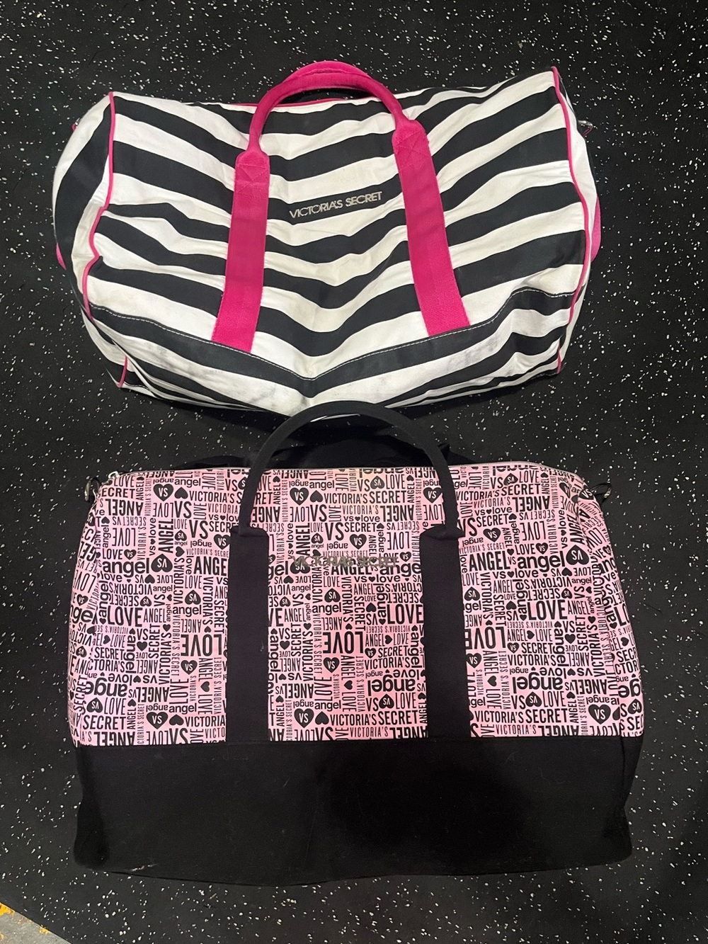 Two Victoria’s Secret duffle bags.